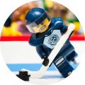 Kulatý jedlý obrázek na dort – Lego hokej (modrá, bílá, černá)