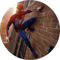 Kulatý jedlý obrázek na dort – Spiderman, šplhání po cihlovém mrakodrapu (červená, modrá, hnědá)