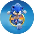 Kulatý jedlý obrázek na dort – Sonic, skok z prstenu nad městem (modrá, žlutá, bílá)