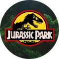 Kulatý jedlý obrázek na dort – Dinosaurus, Jurassic Park logo v kapradí (zelená, černá, žlutá)
