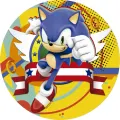 Kulatý jedlý obrázek na dort – Sonic, v běhu se zlatými prsteny (modrá, žlutá, červená)