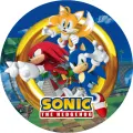 Kulatý jedlý obrázek na dort – Sonic, s Knucklesem a Tailsem u palem (modrá, žlutá, zelená)