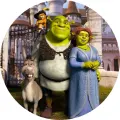 Kulatý jedlý obrázek na dort – Shrek, celá parta před pohádkovým hradem (zelená, modrá, hnědá)