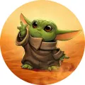 Kulatý jedlý obrázek na dort – Star Wars, Grogu v písku používající Sílu (žlutá, hnědá, zelená)