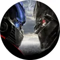 Kulatý jedlý obrázek na dort – Transformers, souboj Optima Prima s Megatronem (černá, šedá, modrá)