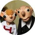 Kulatý jedlý obrázek na dort – Spejbl a Hurvínek, spolu vedle sebe (hnědá, červená, černá)