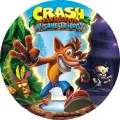 Kulatý jedlý obrázek na dort – Crash Bandicoot, skok z portálu a Aku Aku (modrá, zelená, červená)