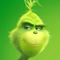 Kulatý jedlý obrázek na dort – Grinch, detailní portrét s úsměvem (zelená, žlutá)
