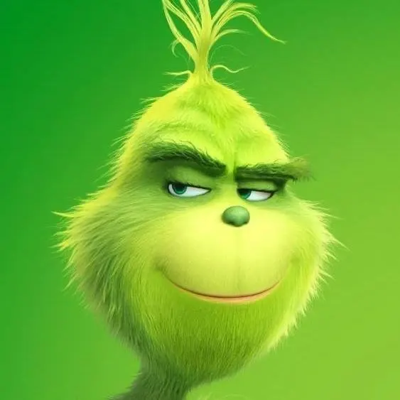 Kulatý jedlý obrázek na dort – Grinch, detailní portrét s úsměvem (zelená, žlutá)