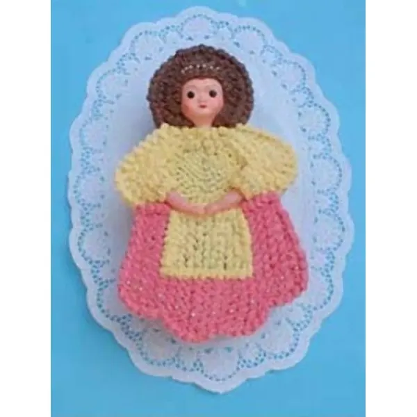 Dortová forma ve tvaru panenky Barbie v dlouhé sukni, vyrobená z pocínovaného plechu
